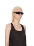 Rick Owens runway look featuring avant garde layered outfit with sculptural silhouette and dark tonal styling