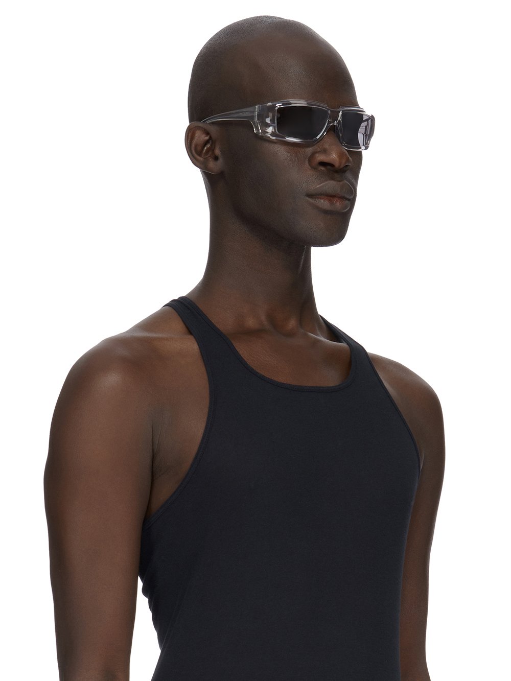 Rick Owens runway look featuring avant garde layered outfit with sculptural silhouette and dark tonal styling