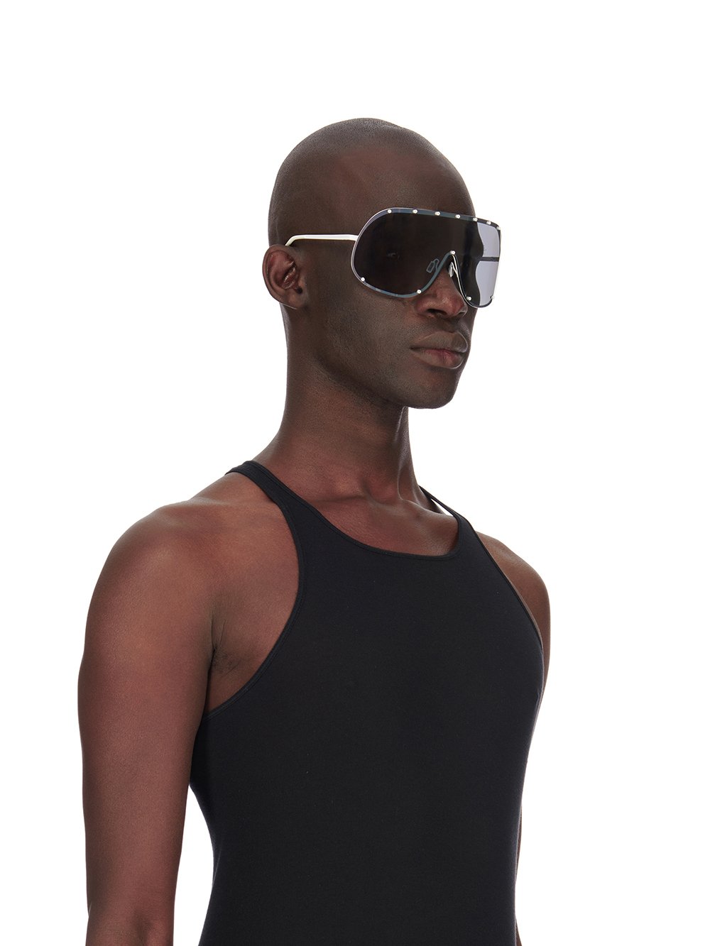 Rick Owens runway look featuring avant garde layered outfit with sculptural silhouette and dark tonal styling