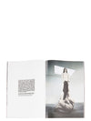 Rick Owens runway look featuring avant garde layered outfit with sculptural silhouette and dark tonal styling