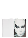 Rick Owens runway look featuring avant garde layered outfit with sculptural silhouette and dark tonal styling