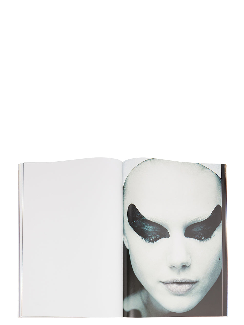 Rick Owens runway look featuring avant garde layered outfit with sculptural silhouette and dark tonal styling