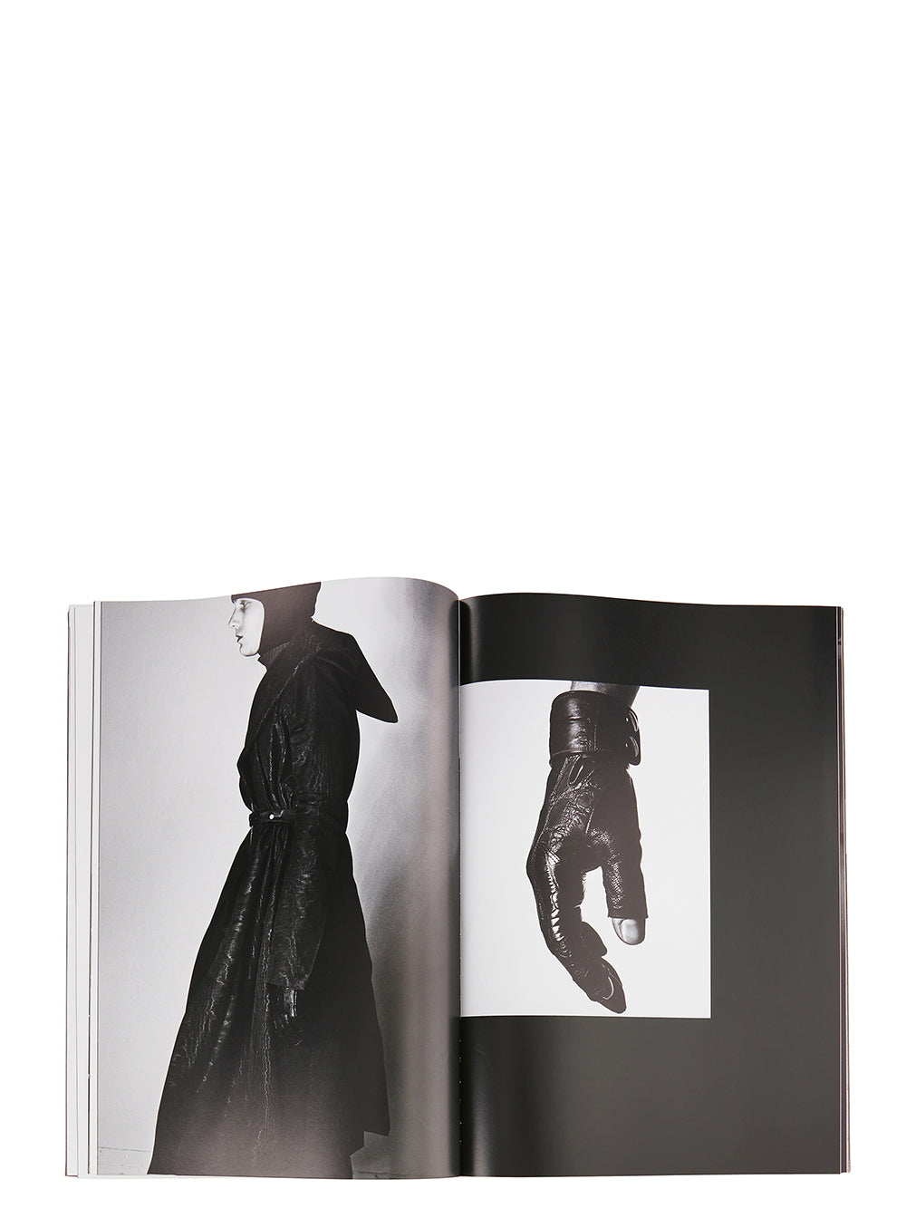 Rick Owens runway look featuring avant garde layered outfit with sculptural silhouette and dark tonal styling