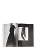 Rick Owens runway look featuring avant garde layered outfit with sculptural silhouette and dark tonal styling