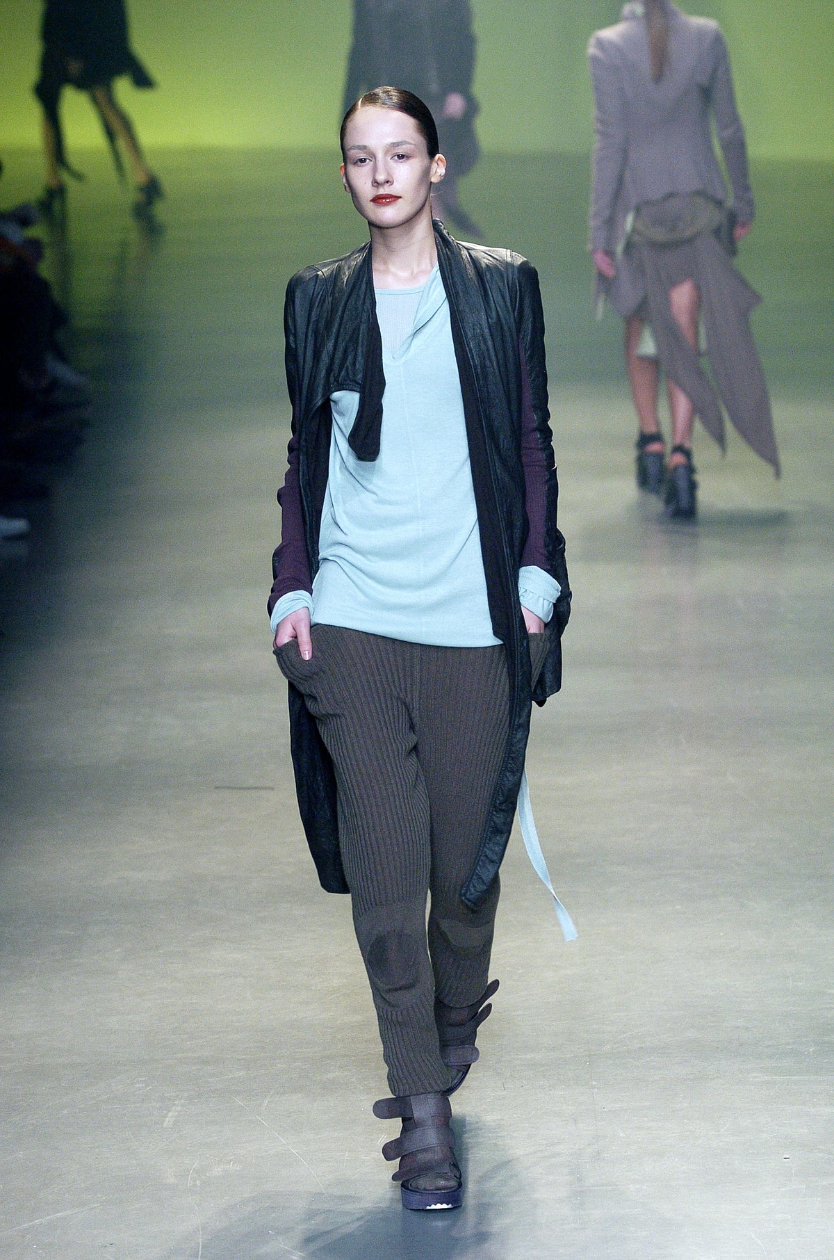 Rick Owens runway look featuring avant garde layered outfit with sculptural silhouette and dark tonal styling