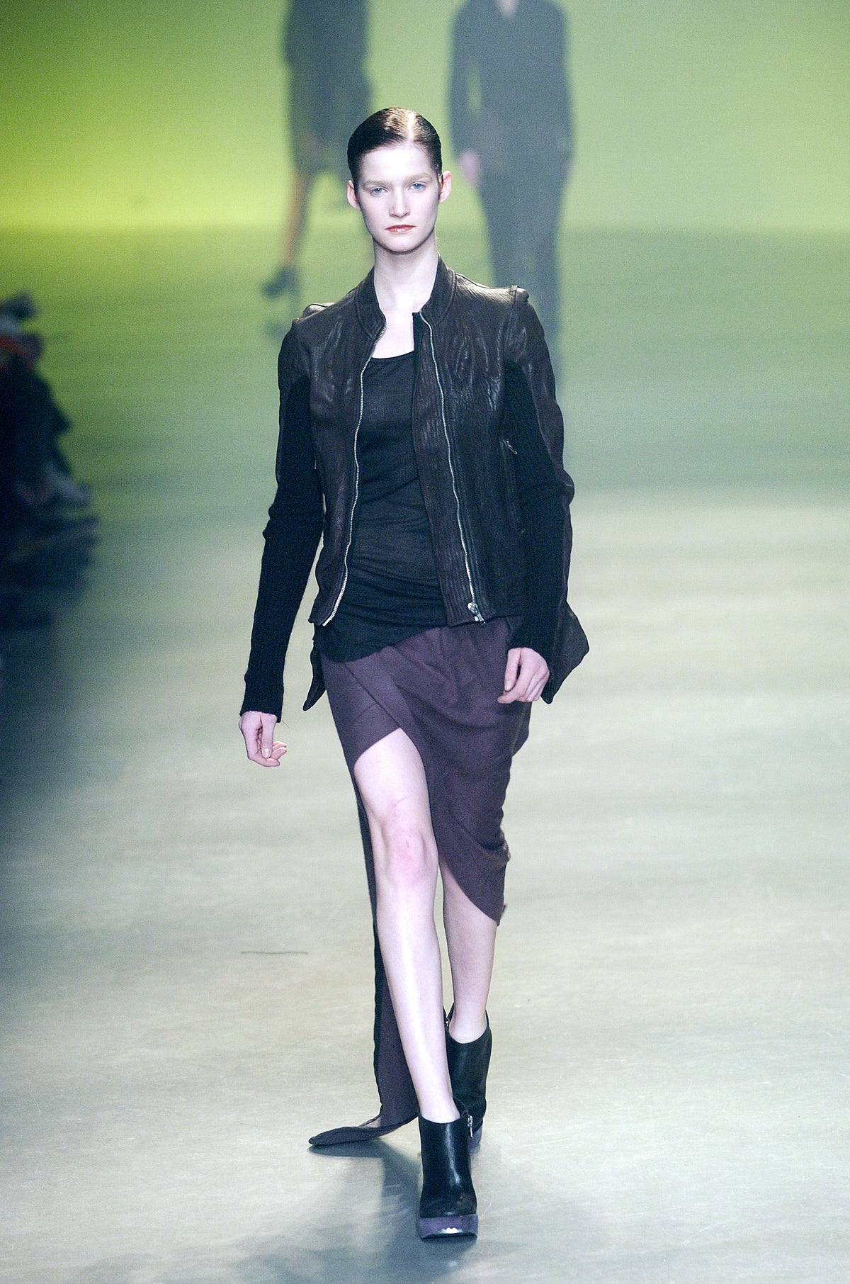 Rick Owens runway look featuring avant garde layered outfit with sculptural silhouette and dark tonal styling