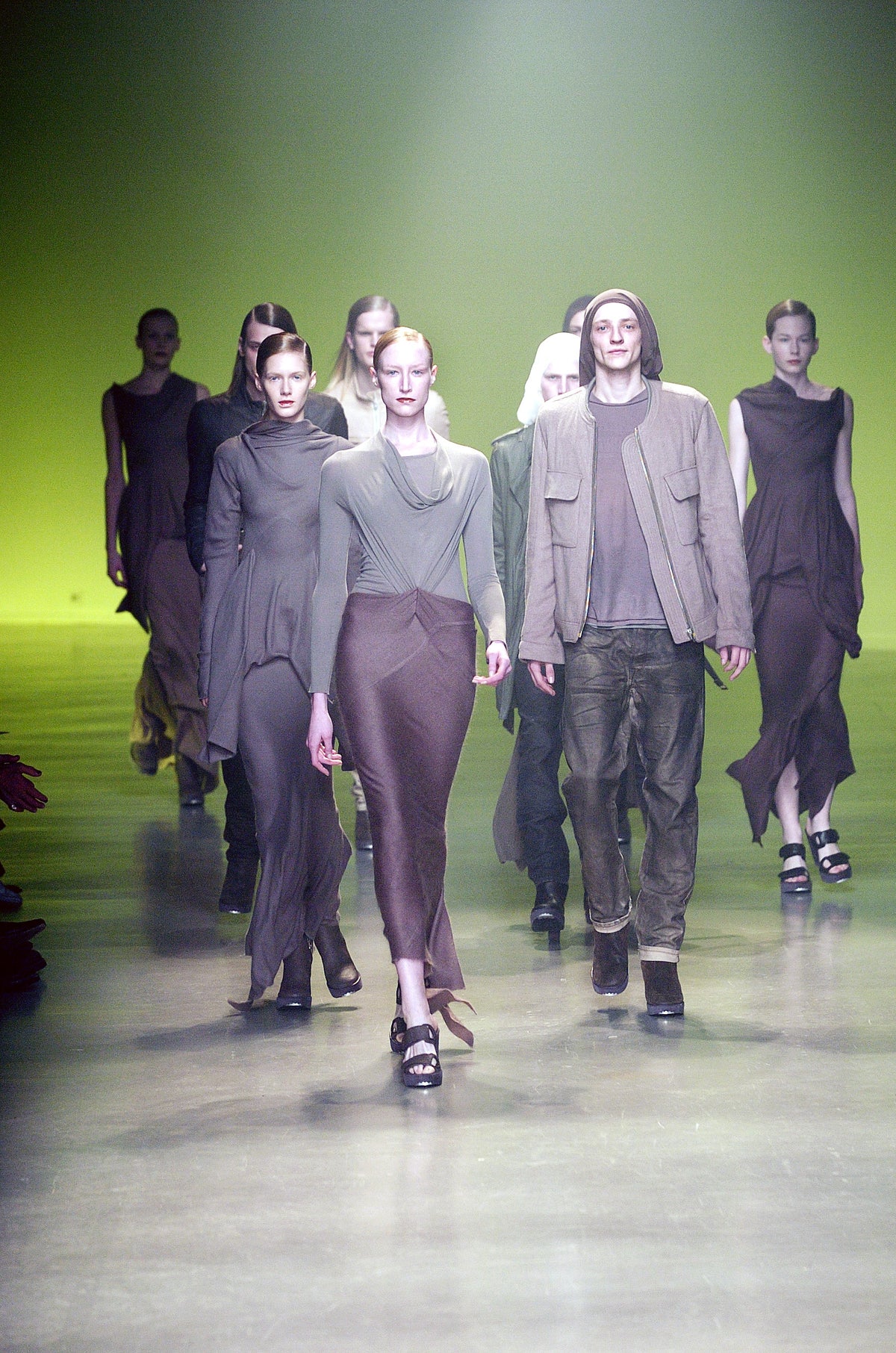 Rick Owens runway look featuring avant garde layered outfit with sculptural silhouette and dark tonal styling