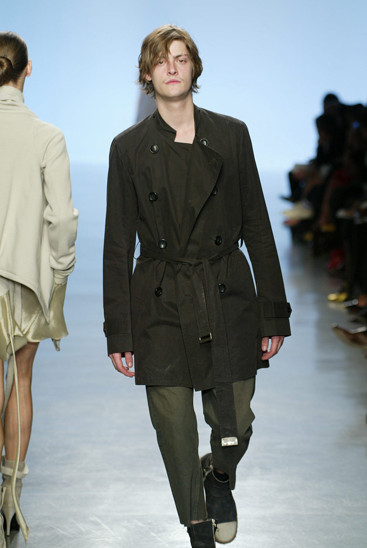 Rick Owens runway look featuring avant garde layered outfit with sculptural silhouette and dark tonal styling