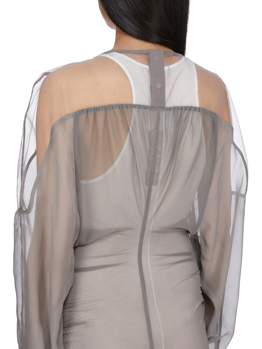Rick Owens runway look featuring avant garde layered outfit with sculptural silhouette and dark tonal styling