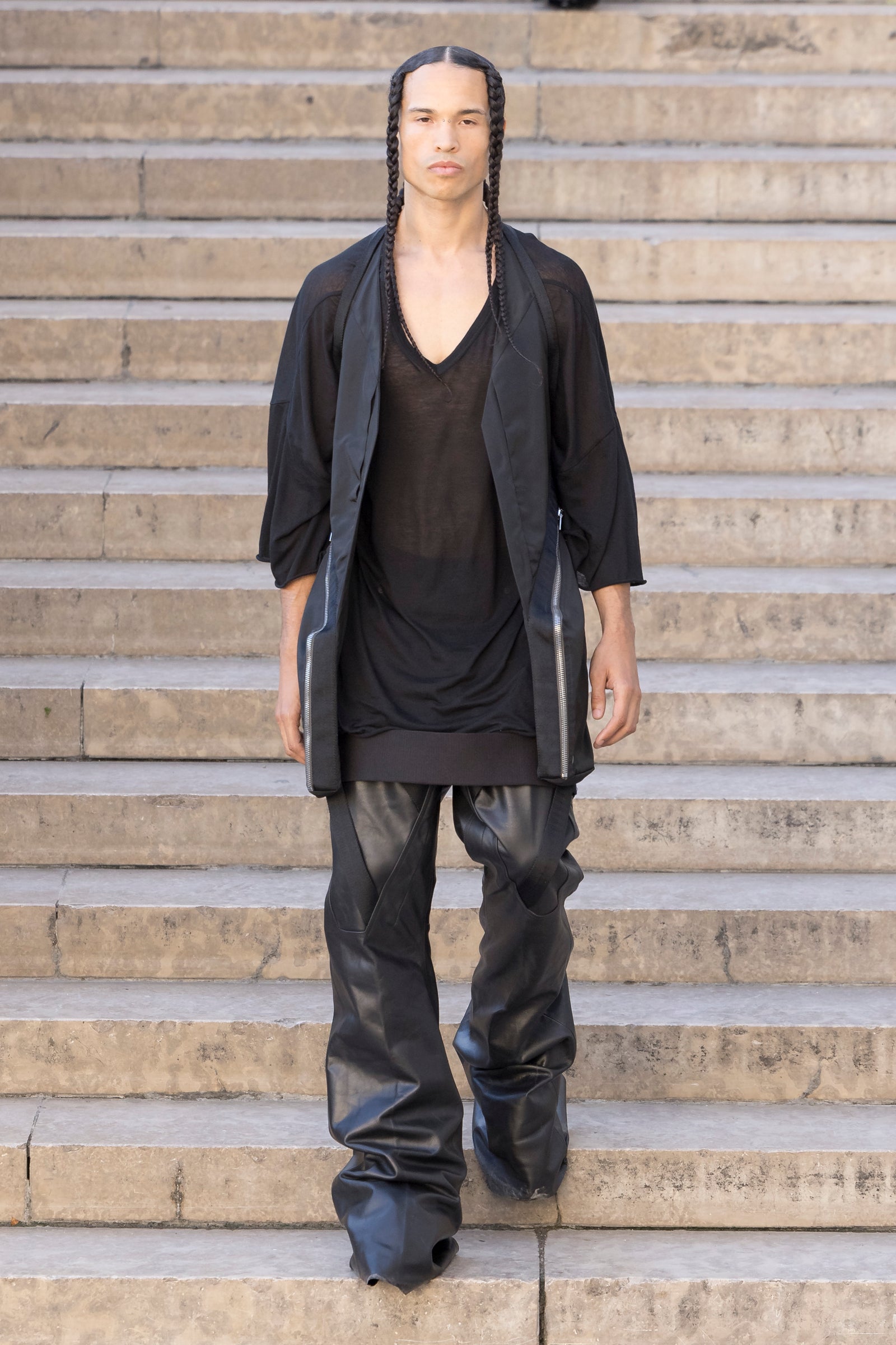 Rick Owens runway look featuring avant garde layered outfit with sculptural silhouette and dark tonal styling