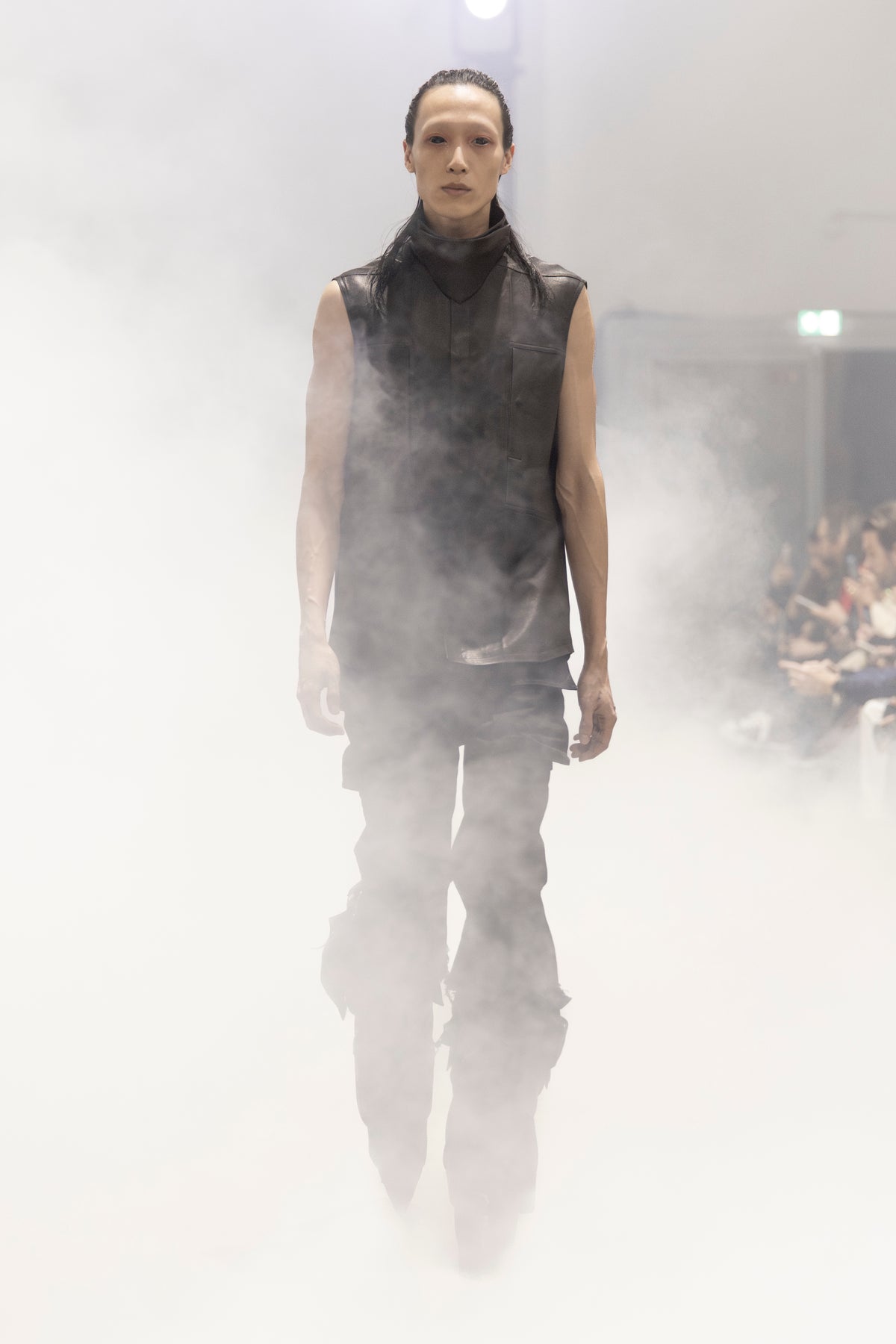 Rick Owens runway look featuring avant garde layered outfit with sculptural silhouette and dark tonal styling