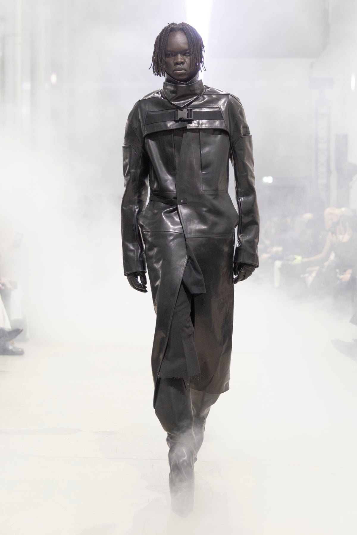 Rick Owens runway look featuring avant garde layered outfit with sculptural silhouette and dark tonal styling