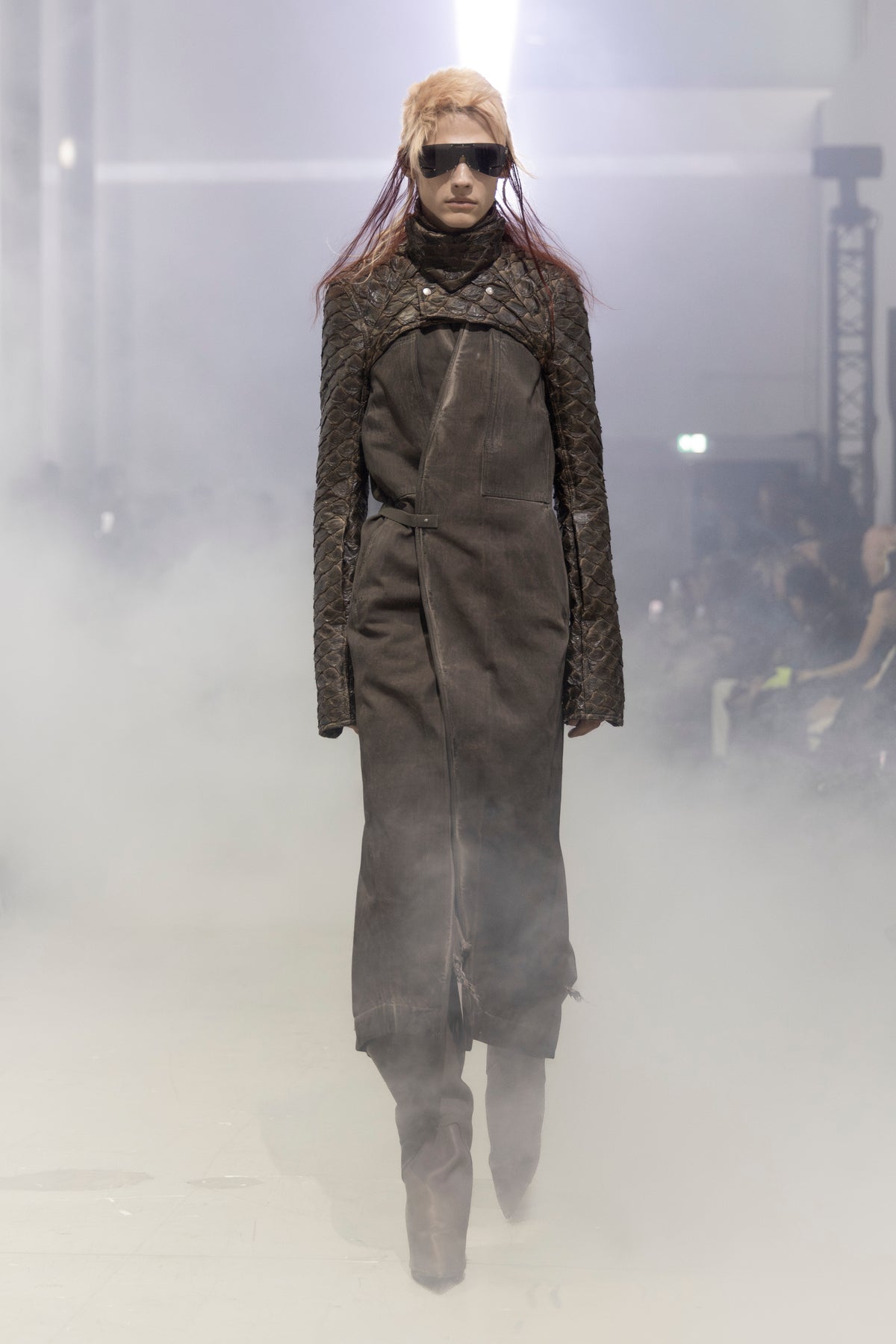 Rick Owens runway look featuring avant garde layered outfit with sculptural silhouette and dark tonal styling