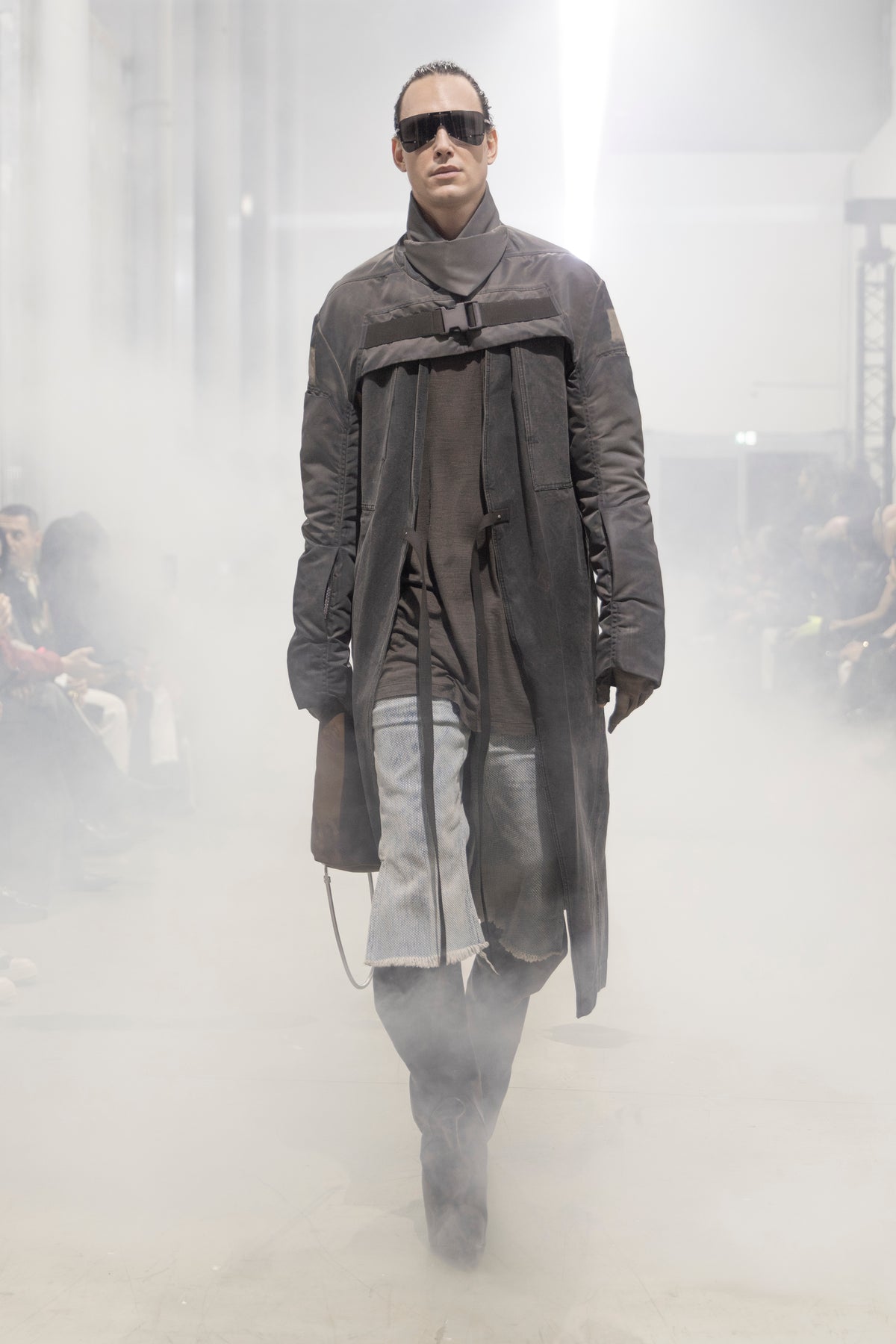 Rick Owens runway look featuring avant garde layered outfit with sculptural silhouette and dark tonal styling