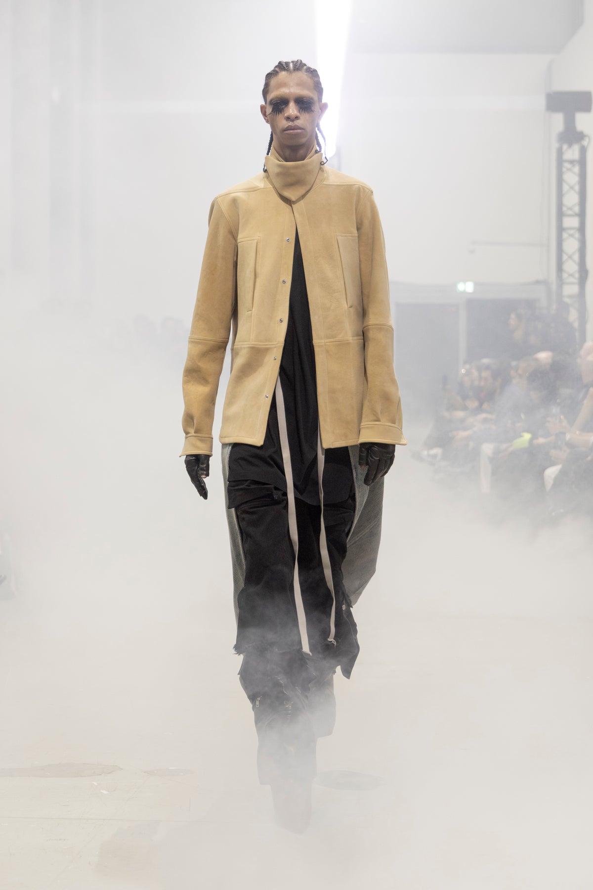 Rick Owens runway look featuring avant garde layered outfit with sculptural silhouette and dark tonal styling