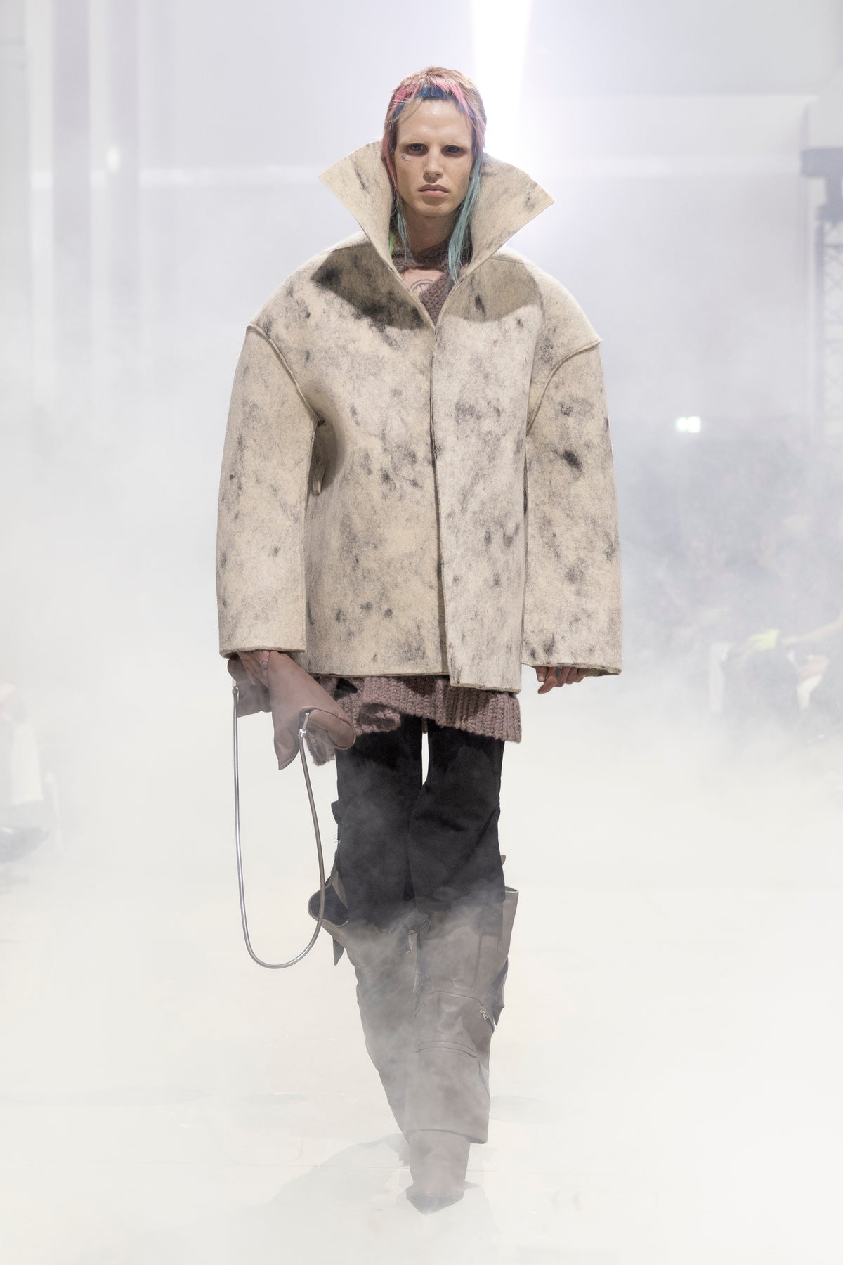 Rick Owens runway look featuring avant garde layered outfit with sculptural silhouette and dark tonal styling