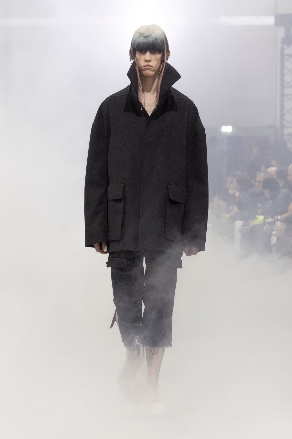 Rick Owens runway look featuring avant garde layered outfit with sculptural silhouette and dark tonal styling