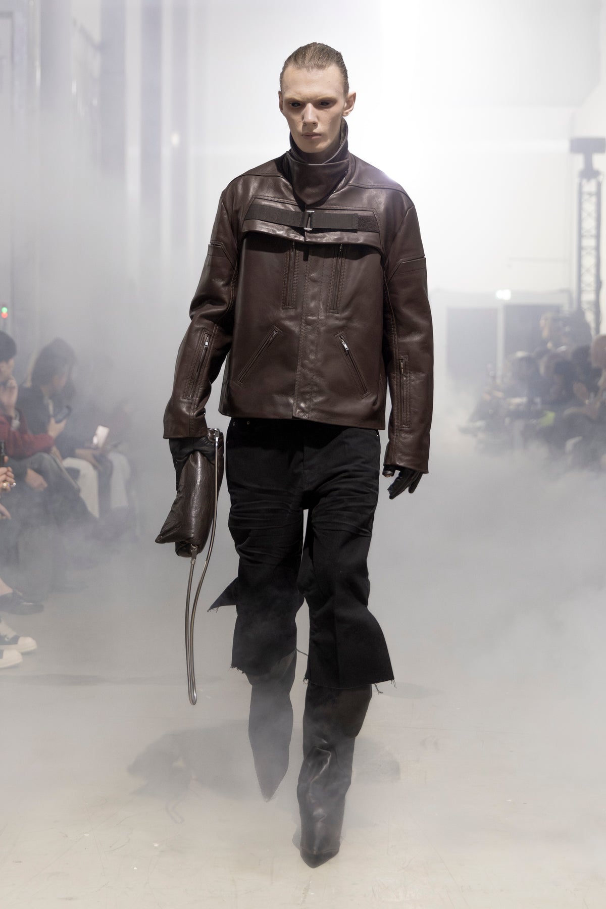 Rick Owens runway look featuring avant garde layered outfit with sculptural silhouette and dark tonal styling