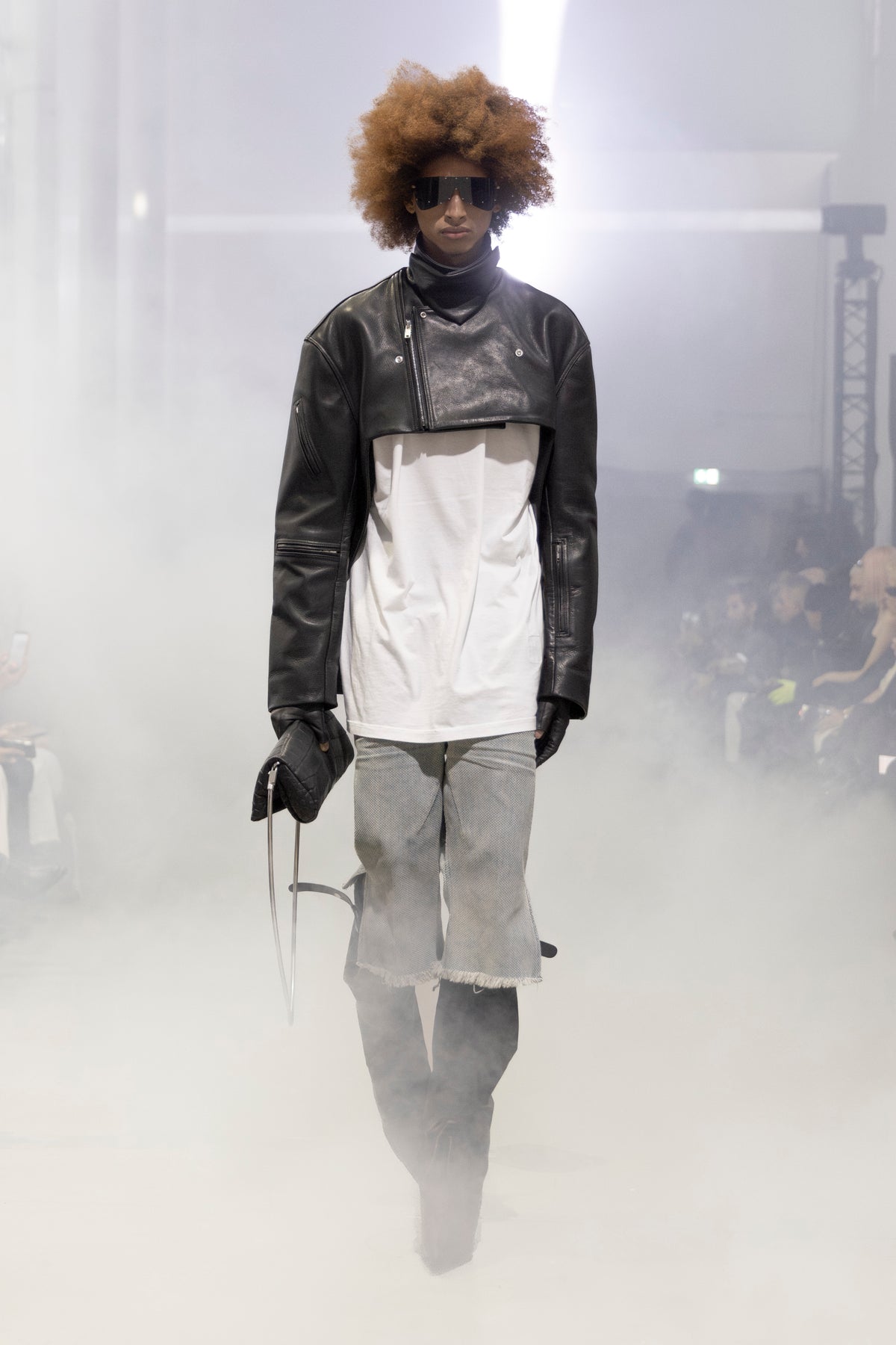 Rick Owens runway look featuring avant garde layered outfit with sculptural silhouette and dark tonal styling