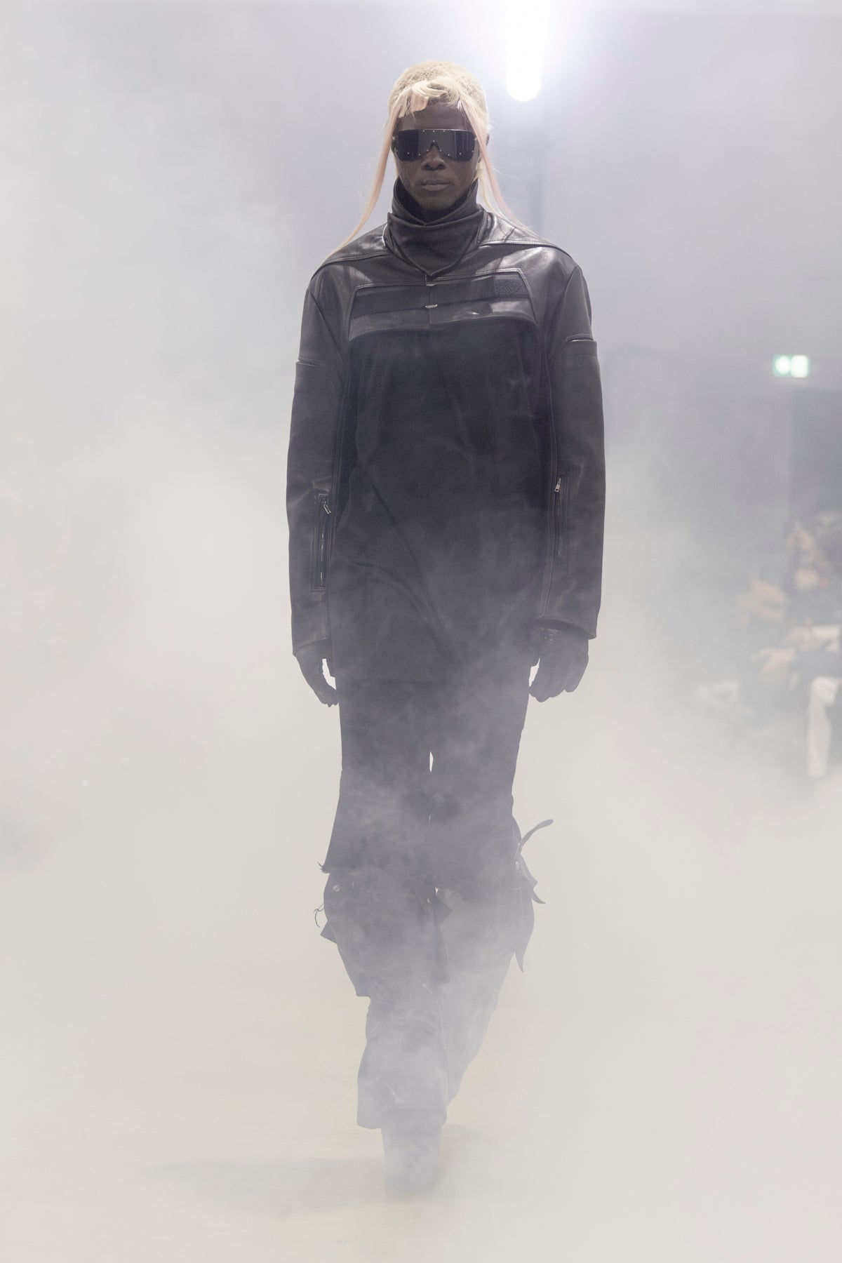 Rick Owens runway look featuring avant garde layered outfit with sculptural silhouette and dark tonal styling
