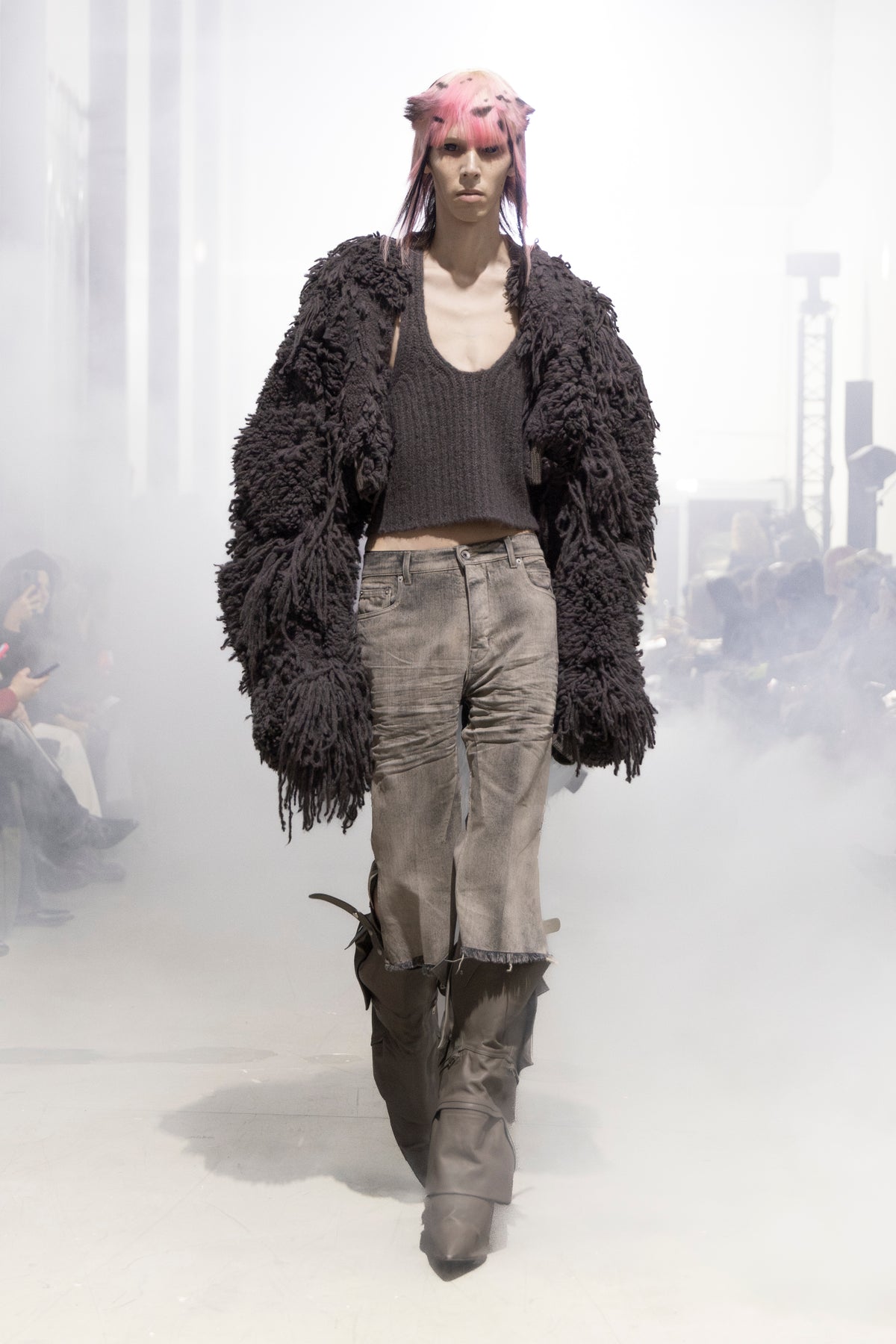 Rick Owens runway look featuring avant garde layered outfit with sculptural silhouette and dark tonal styling