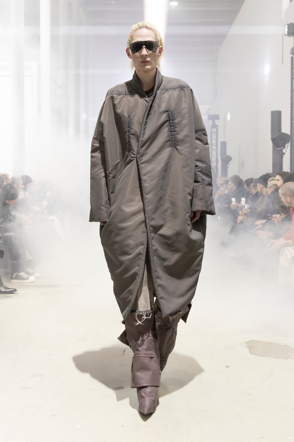 Rick Owens runway look featuring avant garde layered outfit with sculptural silhouette and dark tonal styling