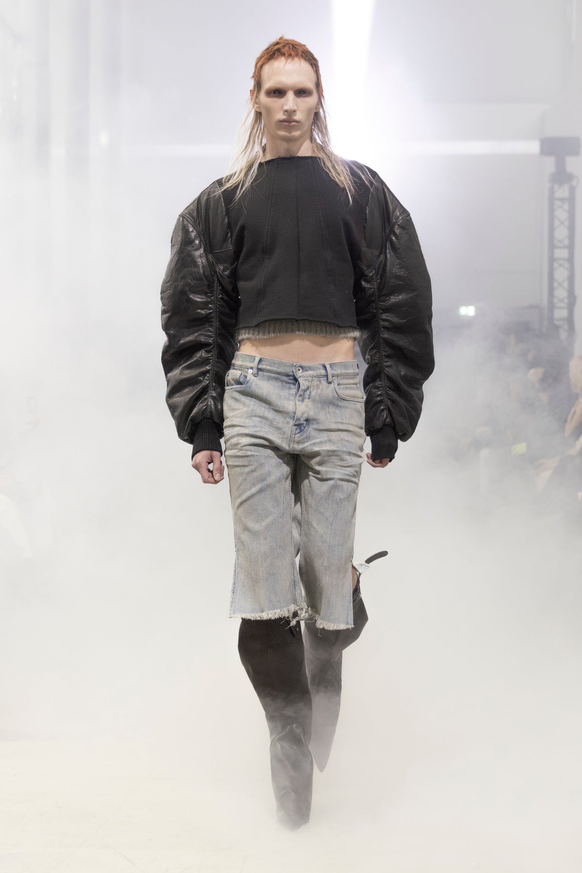 Rick Owens runway look featuring avant garde layered outfit with sculptural silhouette and dark tonal styling