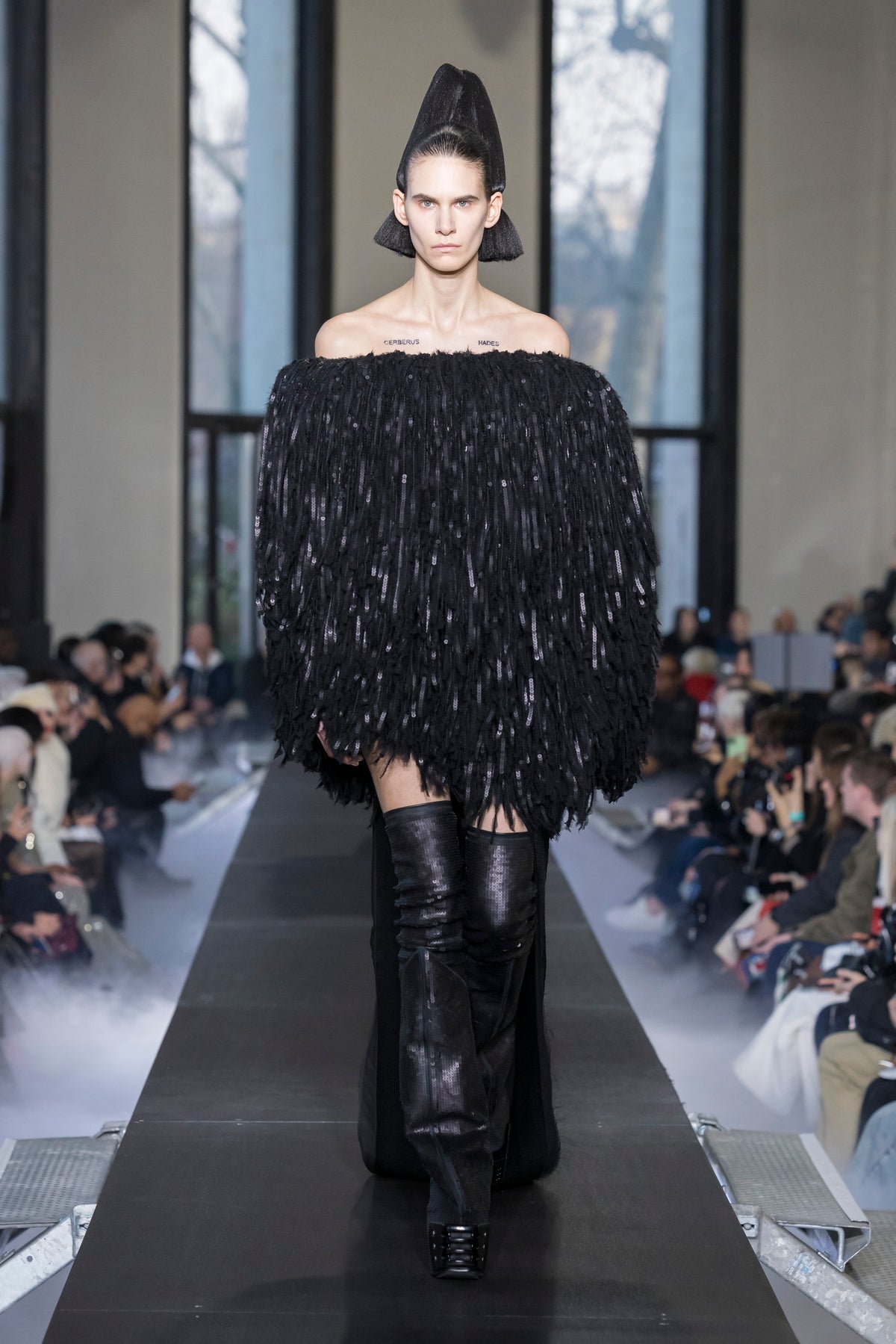 Rick Owens runway look featuring avant garde layered outfit with sculptural silhouette and dark tonal styling
