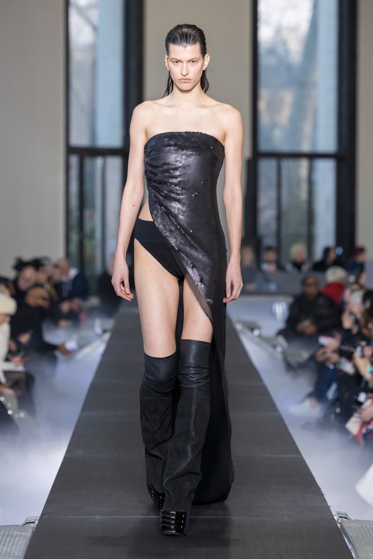 Rick Owens runway look featuring avant garde layered outfit with sculptural silhouette and dark tonal styling