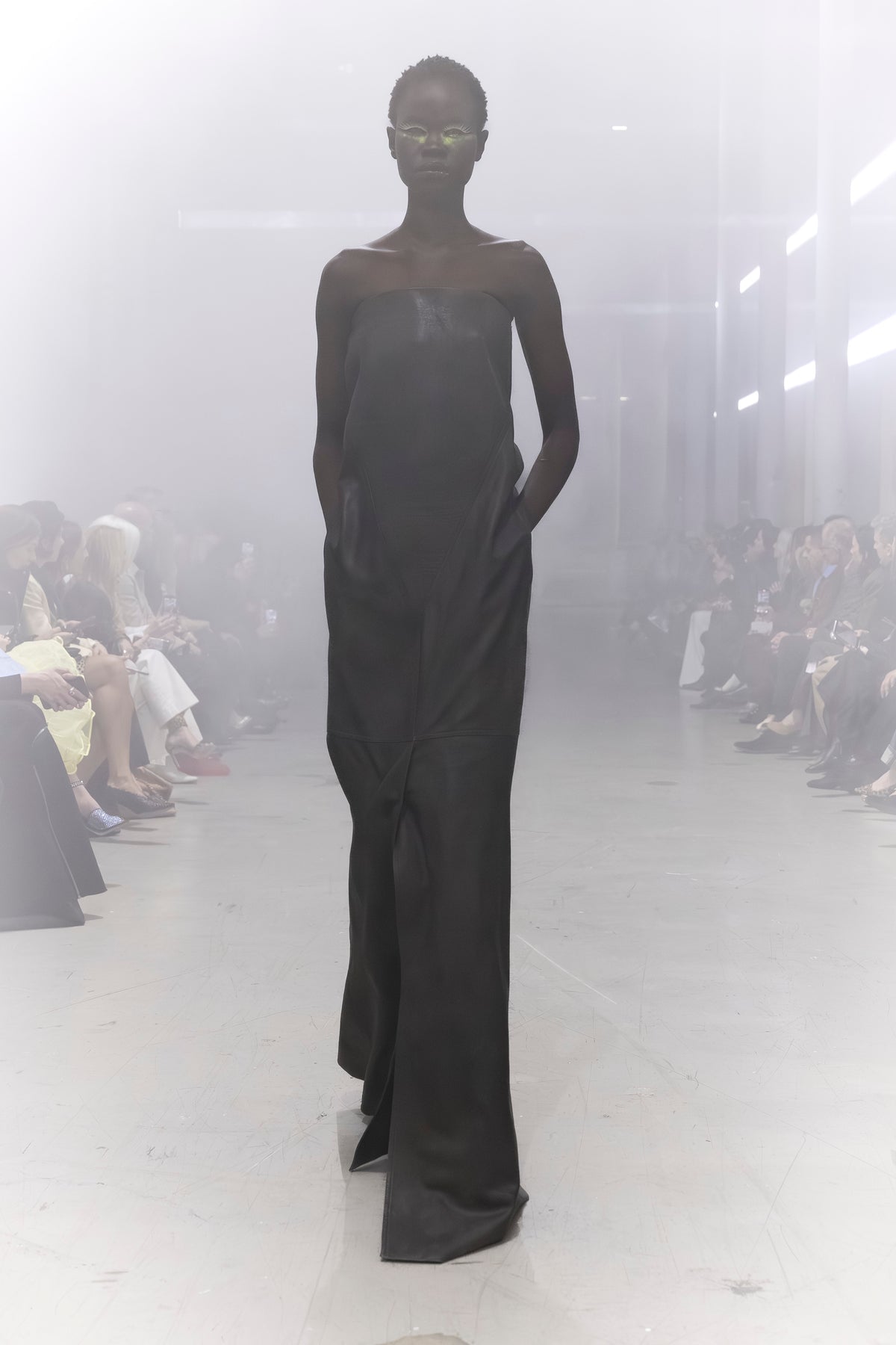 Rick Owens runway look featuring avant garde layered outfit with sculptural silhouette and dark tonal styling