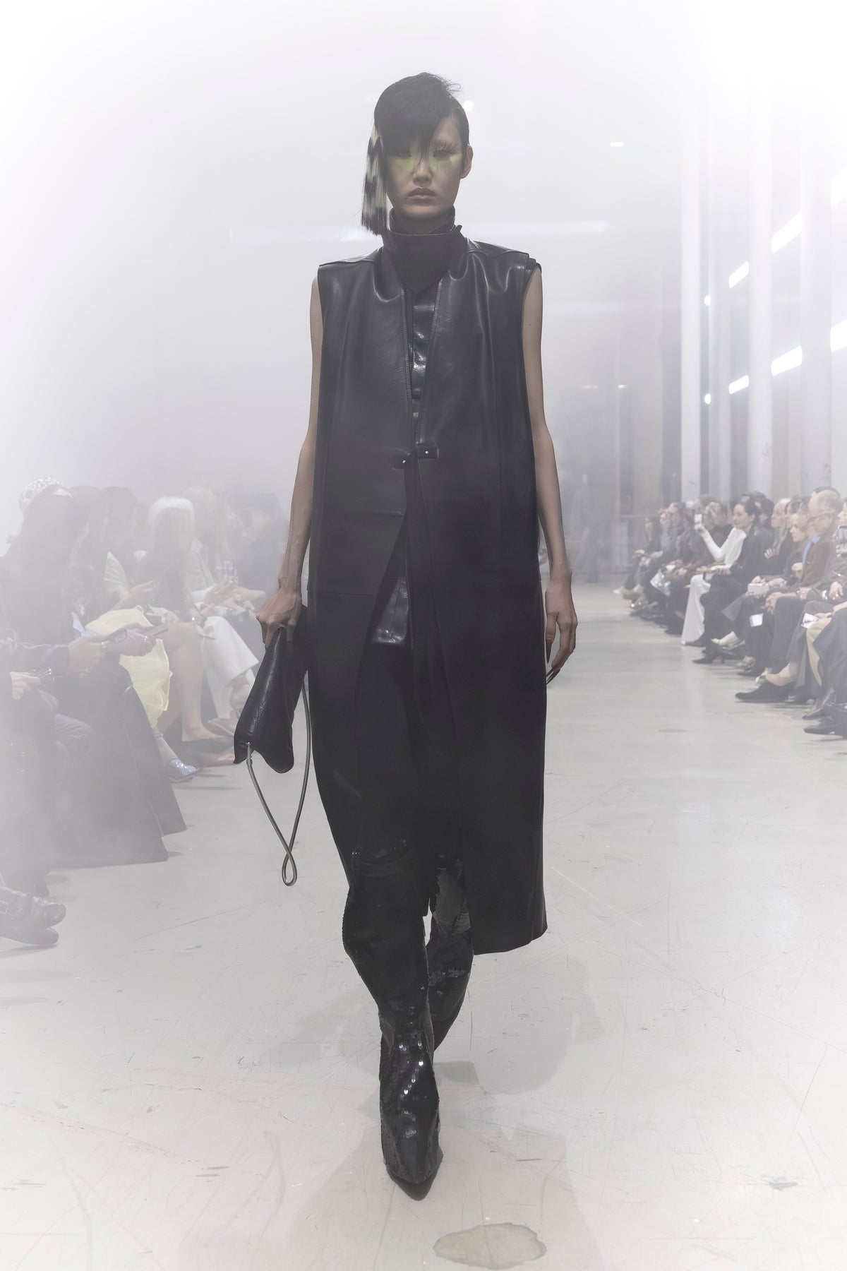 Rick Owens runway look featuring avant garde layered outfit with sculptural silhouette and dark tonal styling