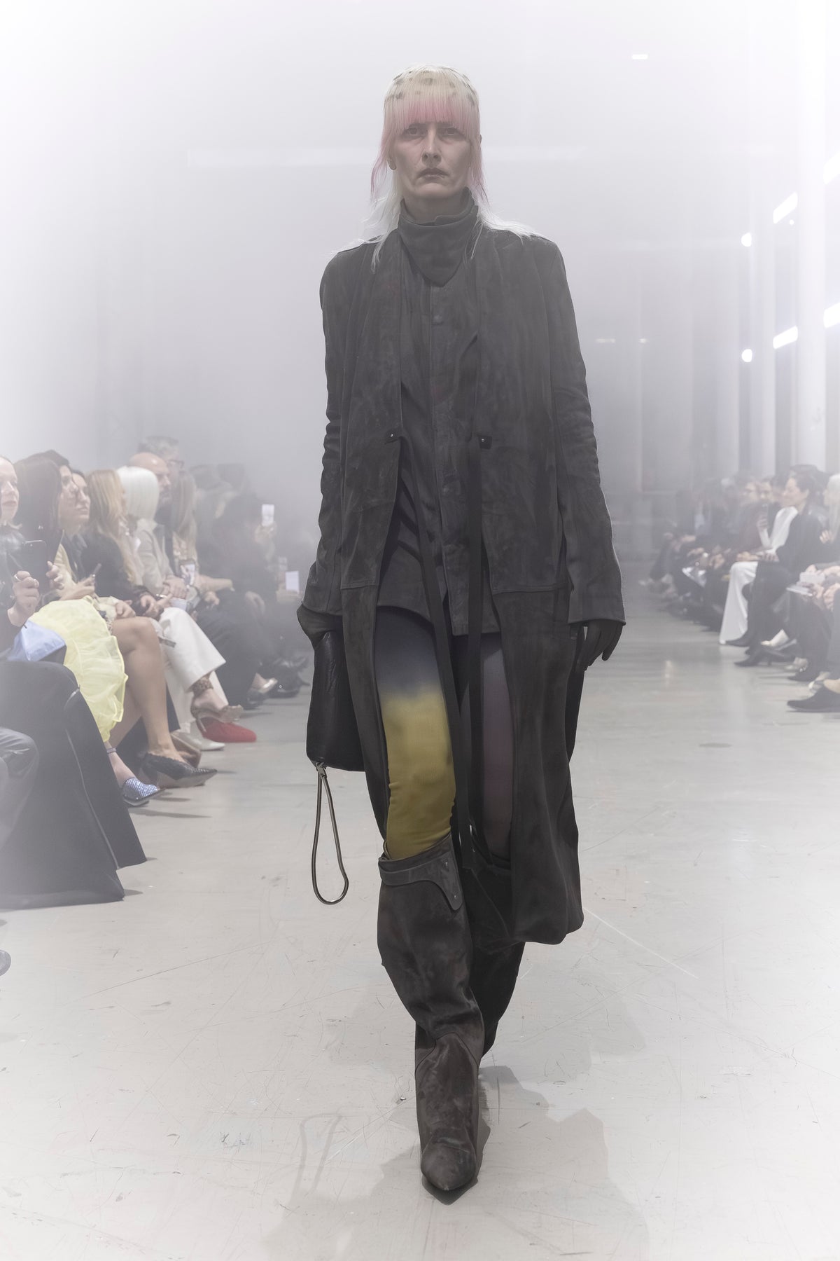 Rick Owens runway look featuring avant garde layered outfit with sculptural silhouette and dark tonal styling