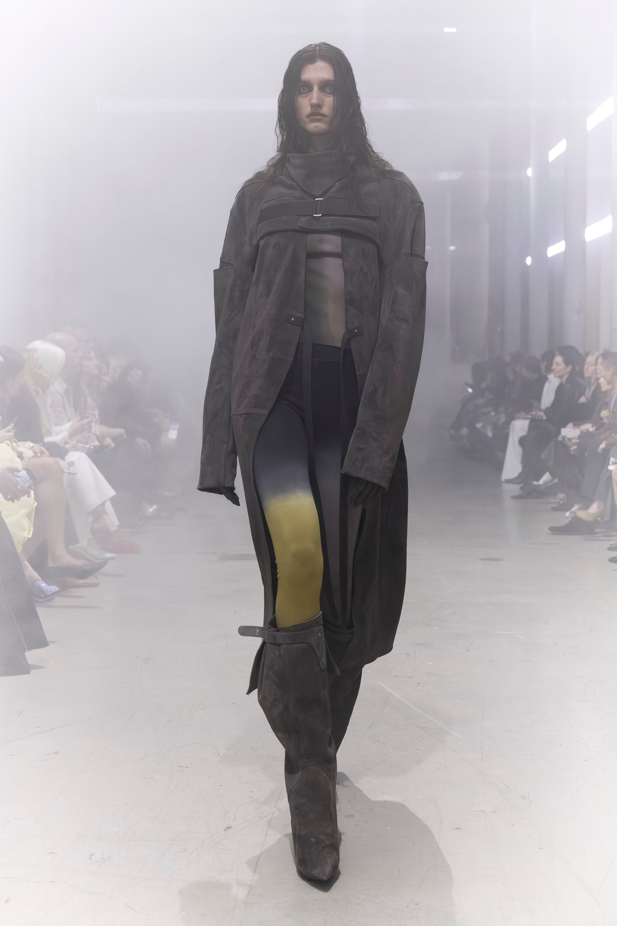 Rick Owens runway look featuring avant garde layered outfit with sculptural silhouette and dark tonal styling