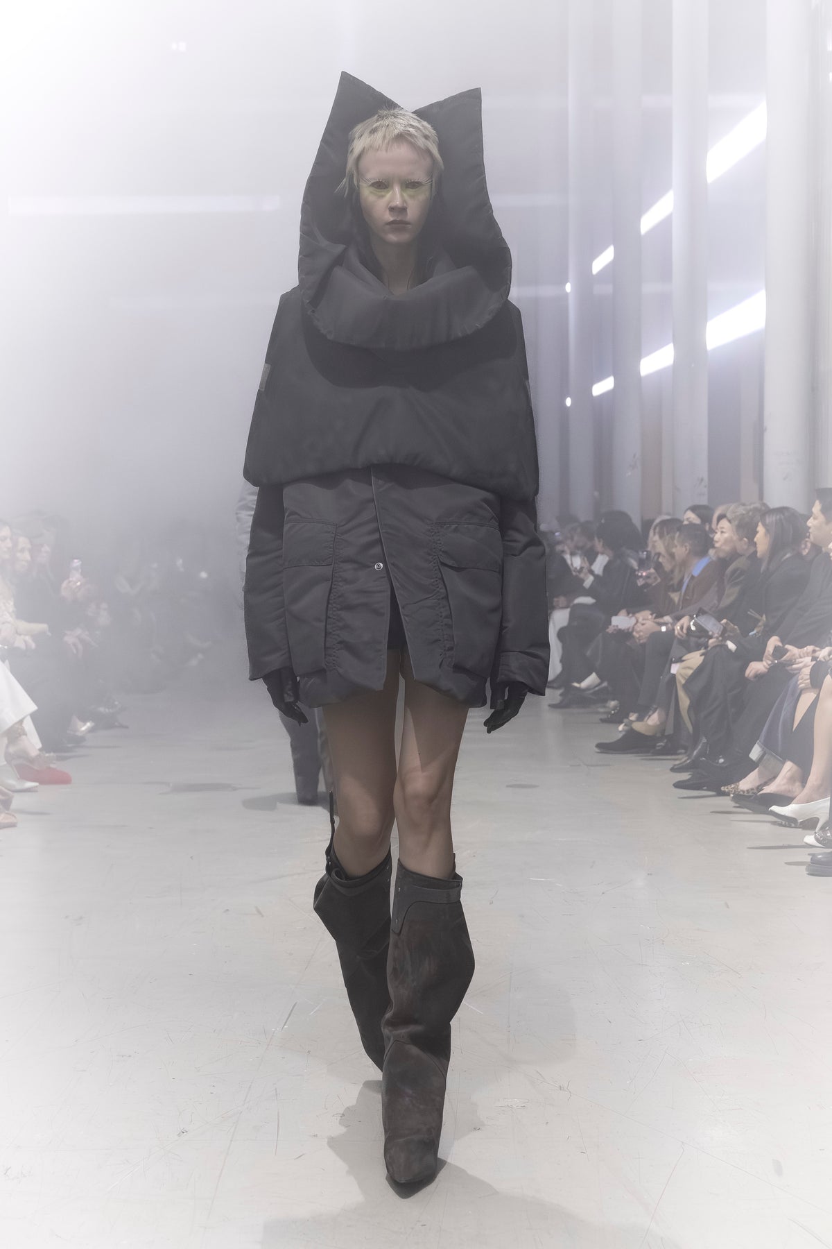 Rick Owens runway look featuring avant garde layered outfit with sculptural silhouette and dark tonal styling