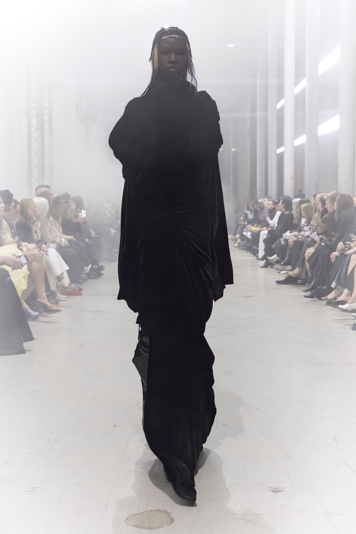 Rick Owens runway look featuring avant garde layered outfit with sculptural silhouette and dark tonal styling
