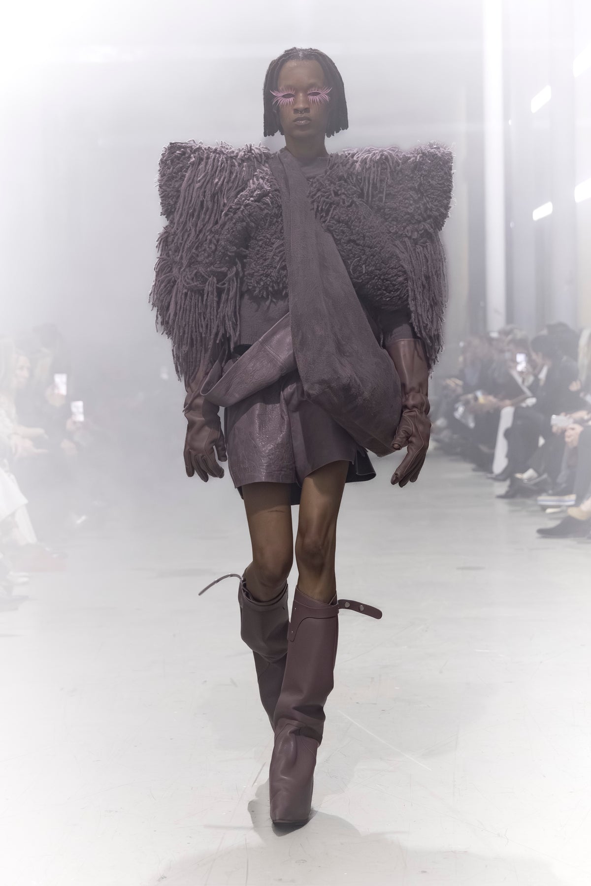 Rick Owens runway look featuring avant garde layered outfit with sculptural silhouette and dark tonal styling