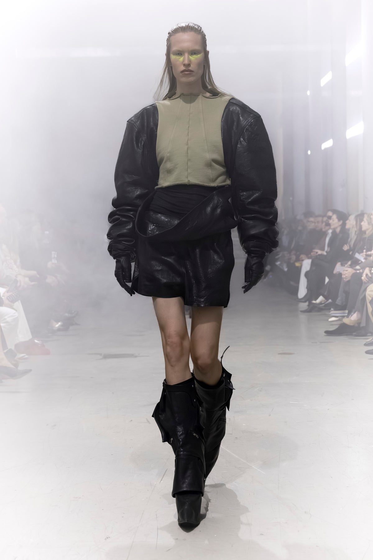 Rick Owens runway look featuring avant garde layered outfit with sculptural silhouette and dark tonal styling