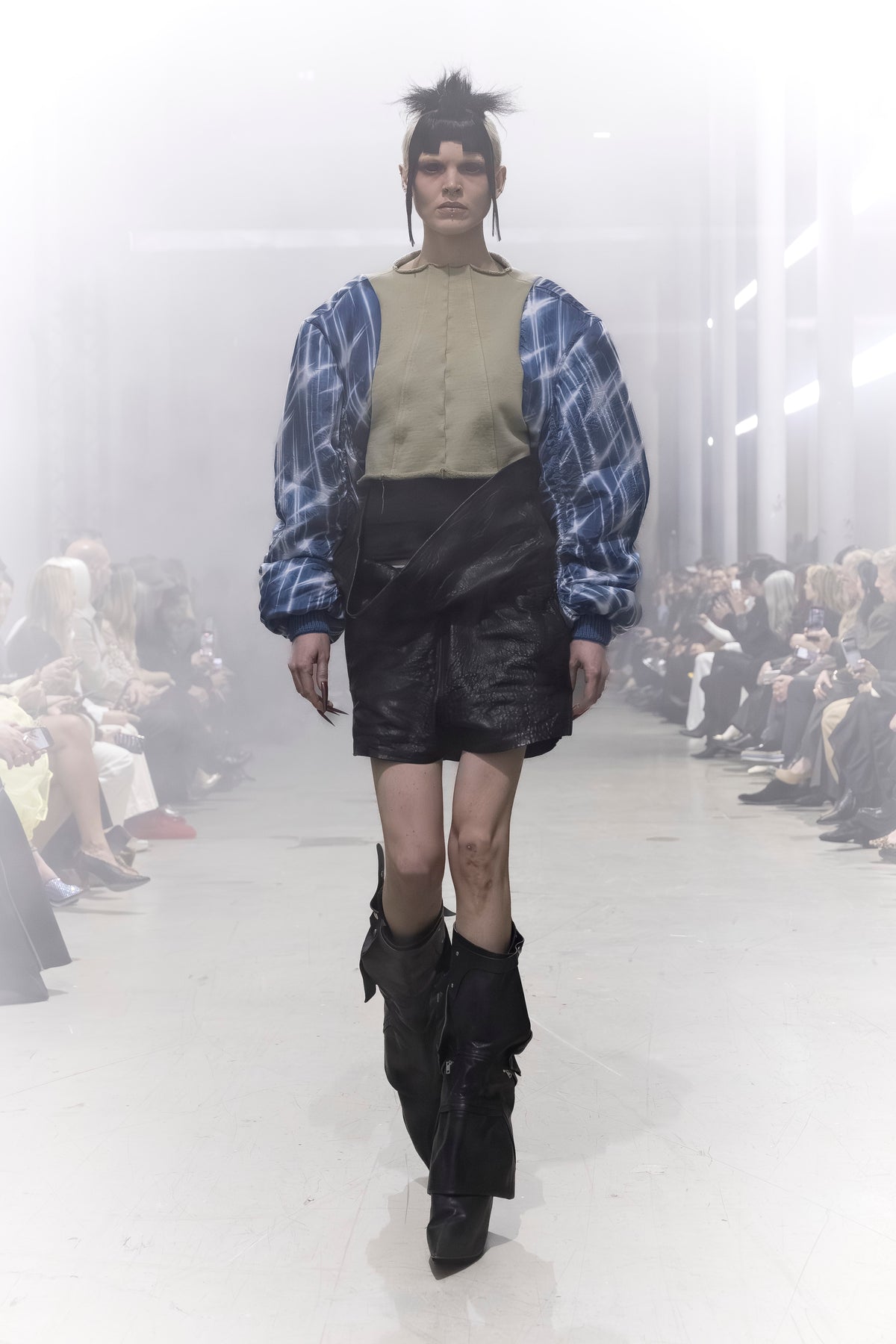 Rick Owens runway look featuring avant garde layered outfit with sculptural silhouette and dark tonal styling