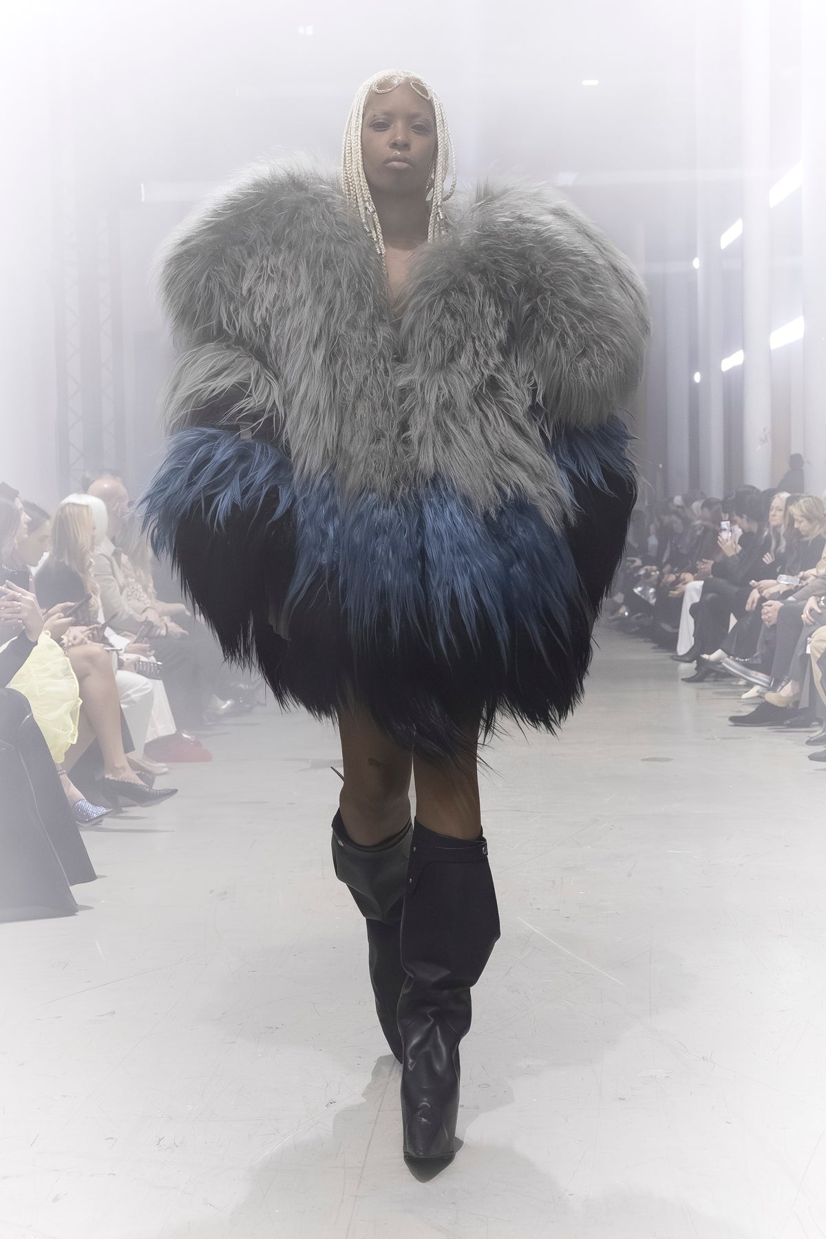 Rick Owens runway look featuring avant garde layered outfit with sculptural silhouette and dark tonal styling