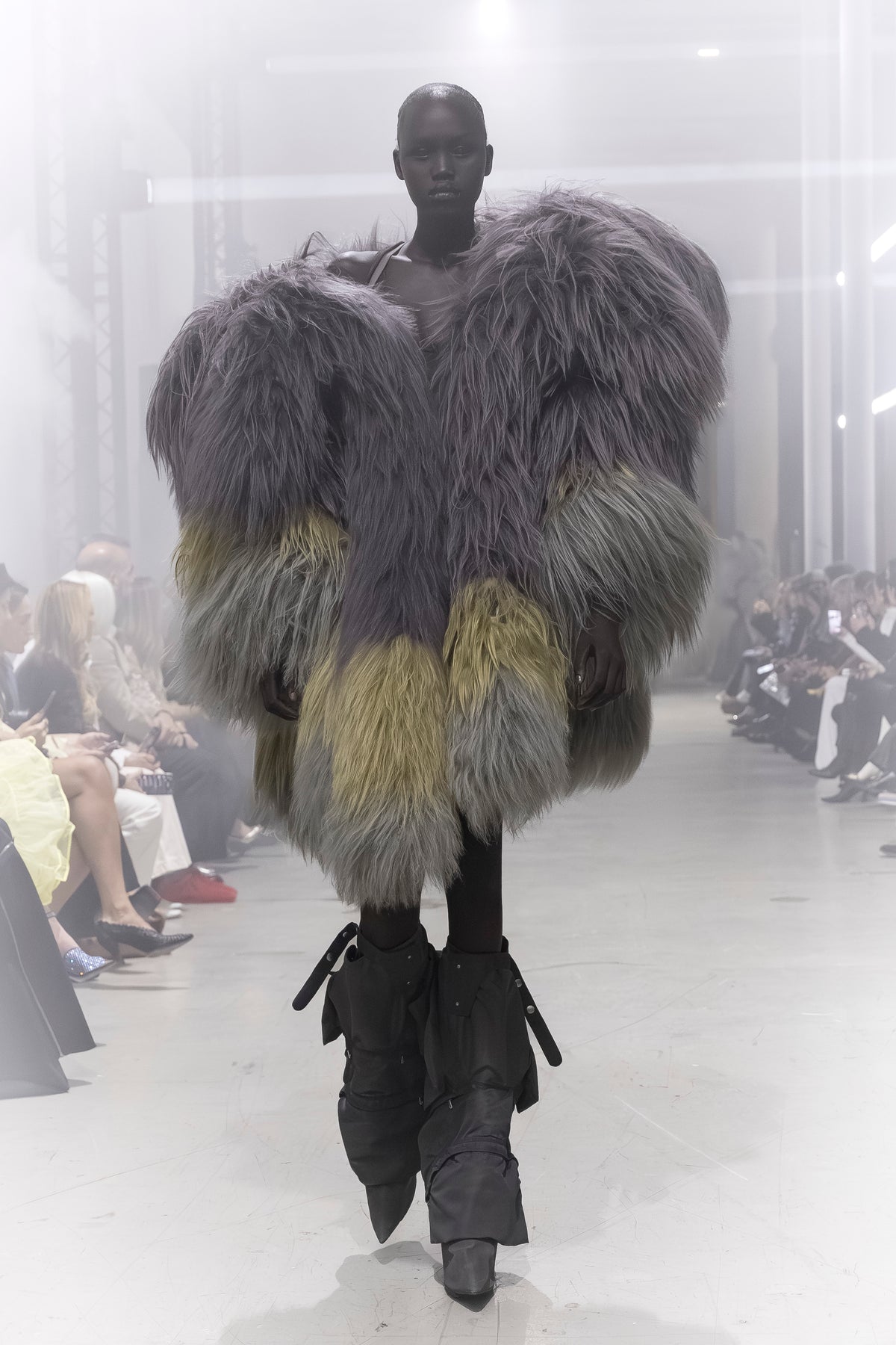 Rick Owens runway look featuring avant garde layered outfit with sculptural silhouette and dark tonal styling