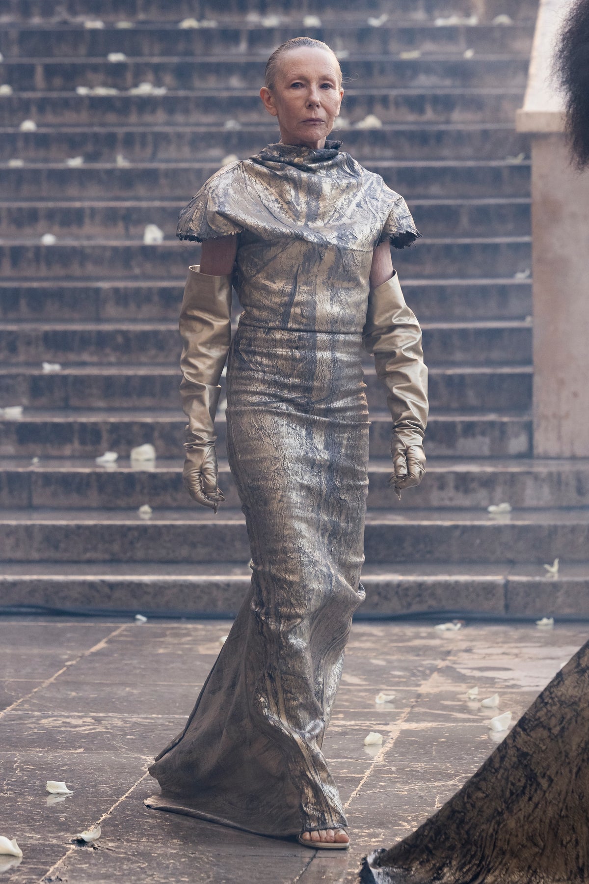 Rick Owens runway look featuring avant garde layered outfit with sculptural silhouette and dark tonal styling