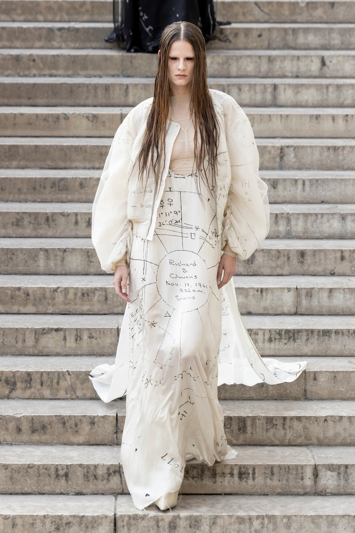 Rick Owens runway look featuring avant garde layered outfit with sculptural silhouette and dark tonal styling