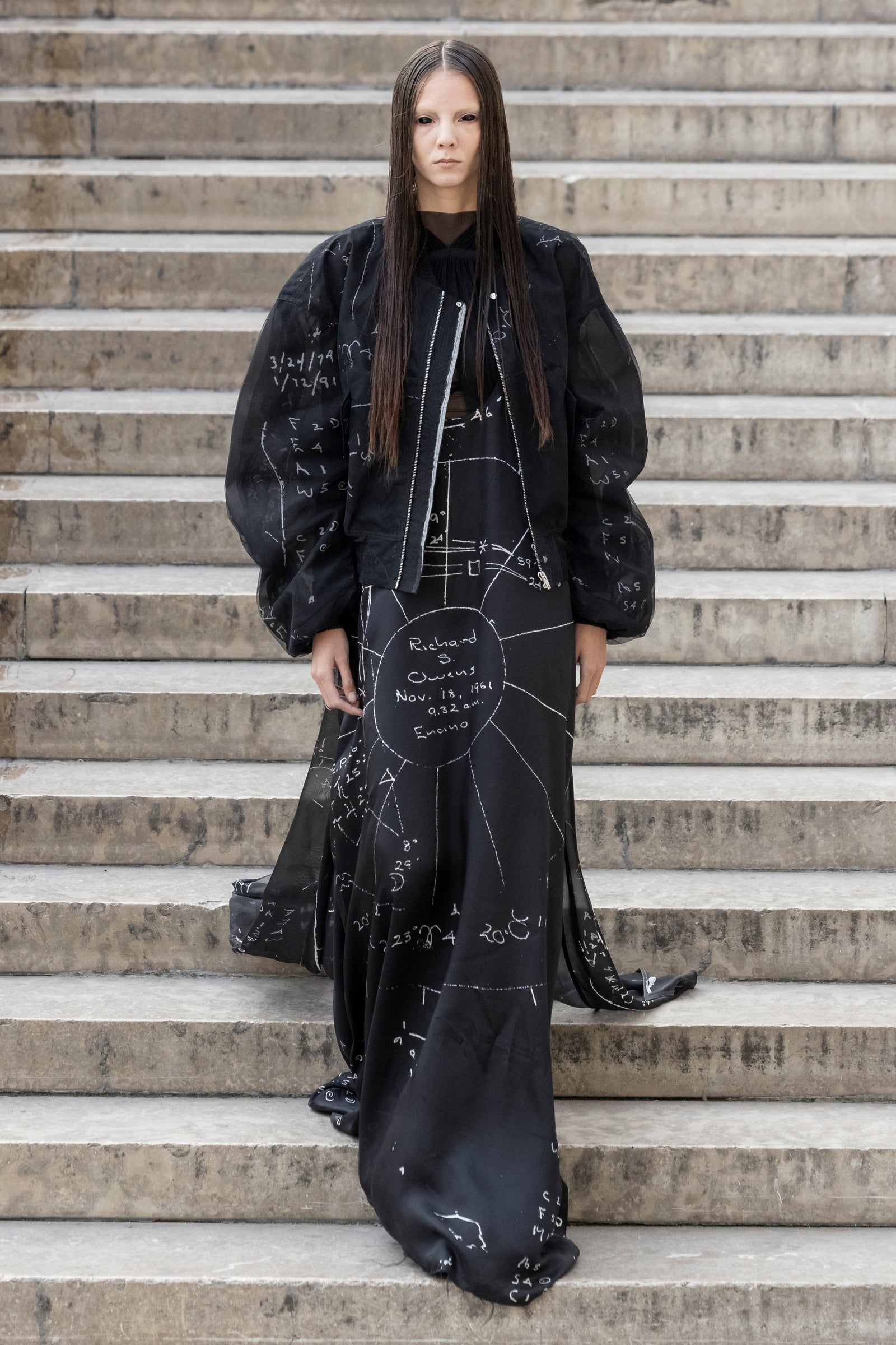 Rick Owens runway look featuring avant garde layered outfit with sculptural silhouette and dark tonal styling